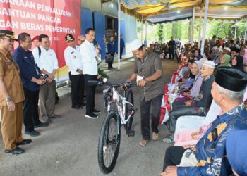 Presiden Jokowi Salurkan Bantuan Pangan di Padanglawas, Hassanudin Pastikan Pemprov Komitmen Jaga Stabilitas dan Ketahanan Pangan di Sumut